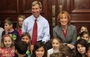 New Hampshire Gov.-elect Maggie Hassan and Gov. John Lynch visit with fourth-graders from Derry, N.H., at the Statehouse on Thursday in Concord. Come January, Hassan will govern a state where — for the first time — all U.S. senators and representatives also are women.