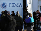Residents wait for information from FEMA in the Rockaway neighborhood of Queens, N.Y. Superstorm Sandy washed away a large section of the iconic boardwalk here on Nov. 2. Residents wait for information from FEMA in the Rockaway neighborhood of Queens, N.Y. Superstorm Sandy washed away a large section of the iconic boardwalk here on Nov. 2.