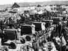 Chinese villagers welcome the arrival of tractors purchased by a farmers' cooperative in April 1958, during the Great Leap Forward campaign. The disastrous modernization program ended in China's great famine and tens of millions of deaths.