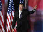 Former Massachusetts Gov. Mitt Romney waves to supporters  before giving his concession speech in Boston on Tuesday.