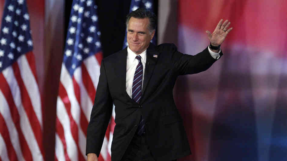 Former Massachusetts Gov. Mitt Romney waves to supporters  before giving his concession speech in Boston on Tuesday.