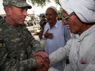 Gen. David Petraeus greets an Iraqi man at a tea shop in Baghdad in 2007. In 2011, Petraeus left the Army to become CIA director. He resigned Friday, citing an extramarital affair. Gen. David Petraeus greets an Iraqi man at a tea shop in Baghdad in 2007. In 2011, Petraeus left the Army to become CIA director. He resigned Friday, citing an extramarital affair.