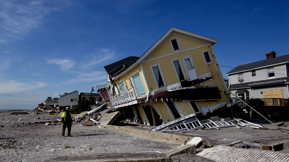 A damaged home rests on one side along the beach in the Belle Harbor section of Queens, N.Y., on Nov. 5 in the wake of Superstorm Sandy.