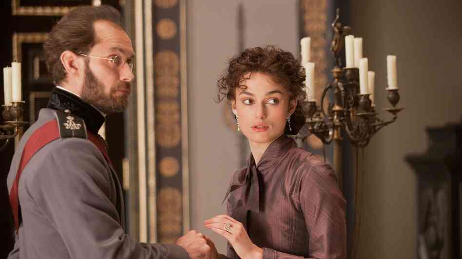 Karenin (Jude Law) tries to rein in his wife, Anna (Keira Knightley), as she pursues a flirtation and then an affair with a handsome young military officer in a new adaptation of Leo Tolstoy's iconic love story. Karenin (Jude Law) tries to rein in his wife, Anna (Keira Knightley), as she pursues a flirtation and then an affair with a handsome young military officer in a new adaptation of Leo Tolstoy's iconic love story.