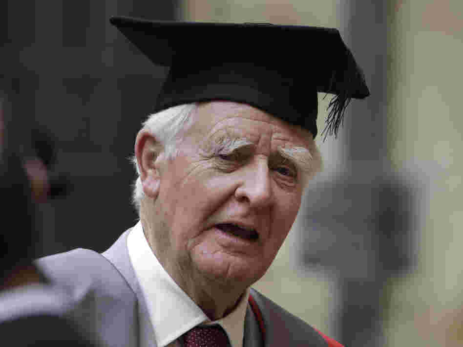 Author John le Carre poses for photographers following a ceremony at Oxford University on June 20.