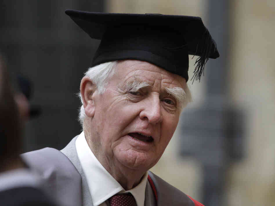 Author John le Carre poses for photographers following a ceremony at Oxford University on June 20.