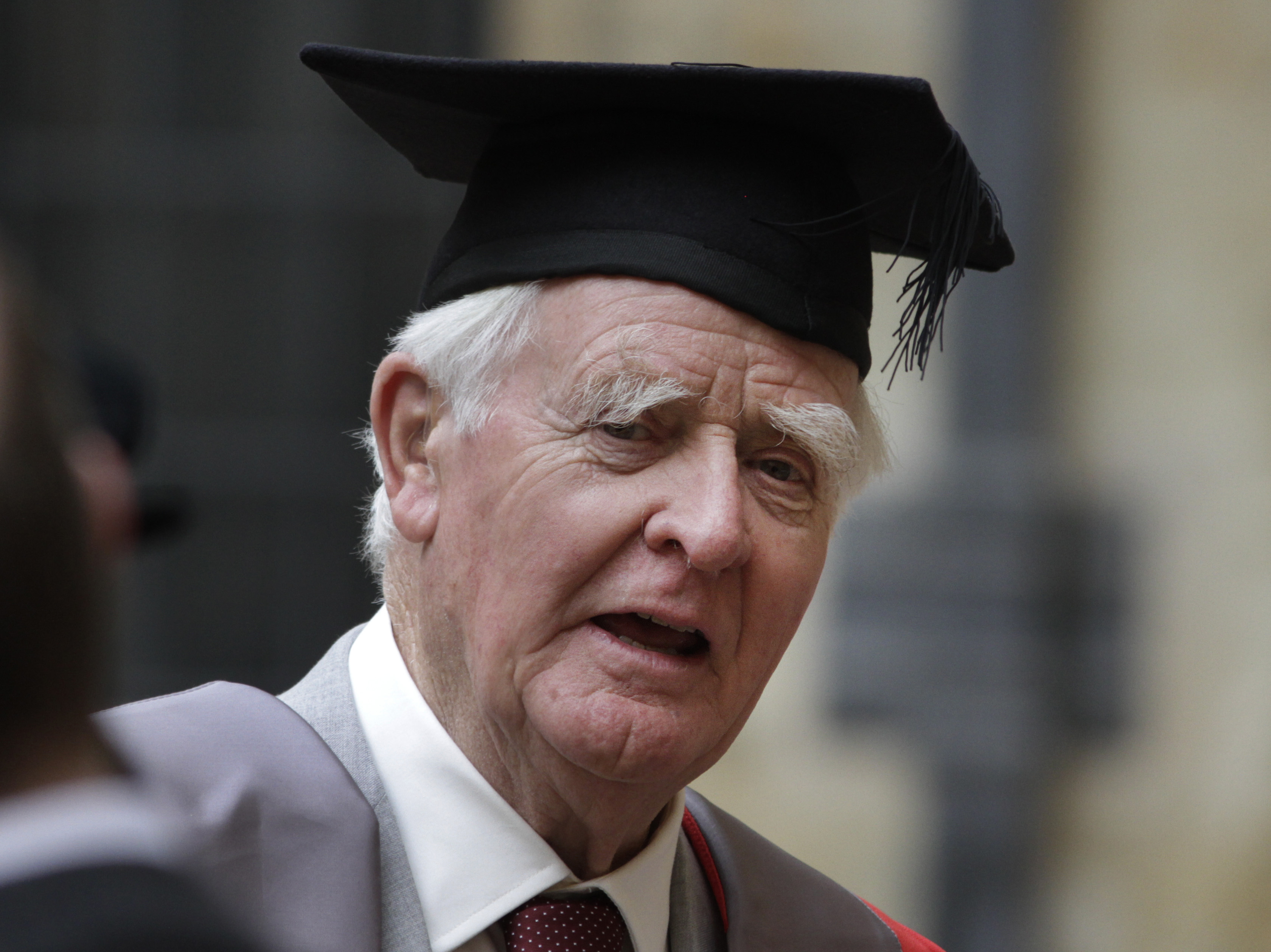 Author John le Carre poses for photographers following a ceremony at Oxford University on June 20. Author John le Carre poses for photographers following a ceremony at Oxford University on June 20.