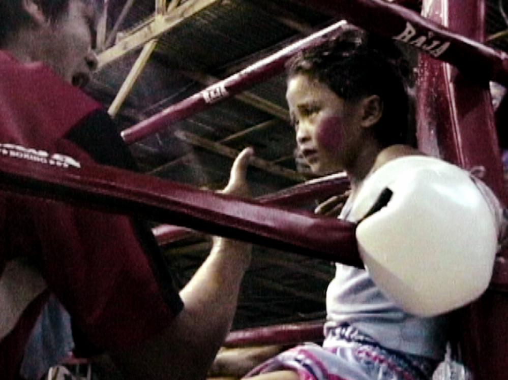 Stam Sor Con Lek fights to support her family. Her winnings go toward completing their half-finished house.