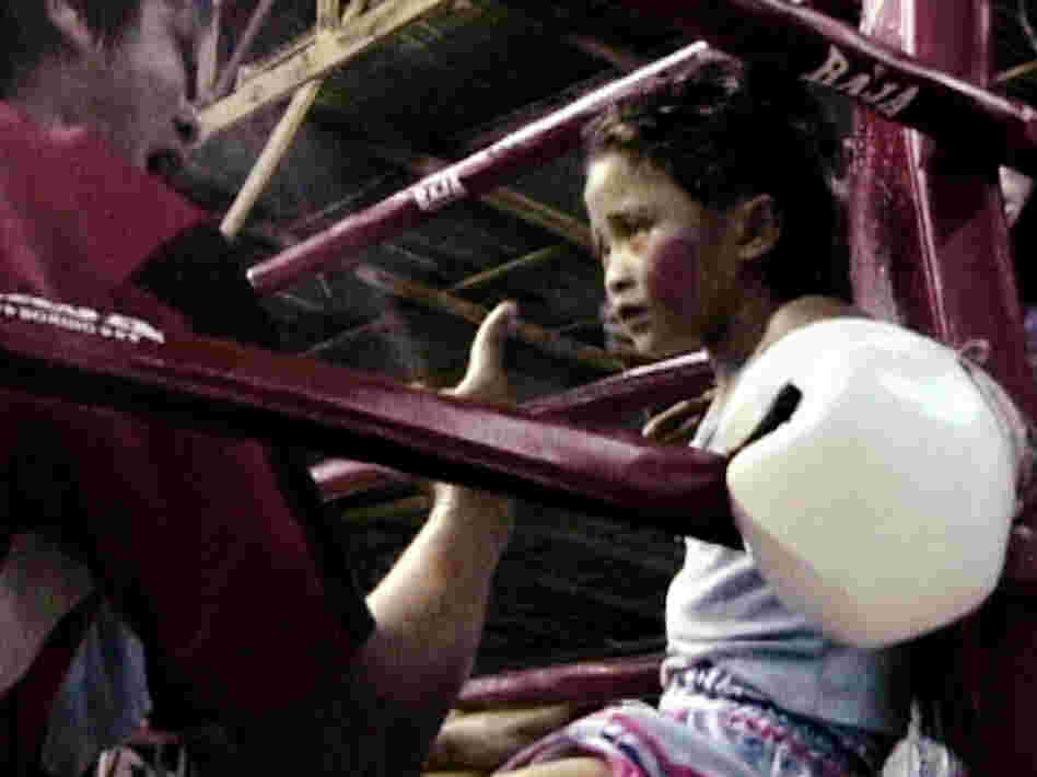 Stam Sor Con Lek fights to support her family. Her winnings go toward completing their half-finished house.