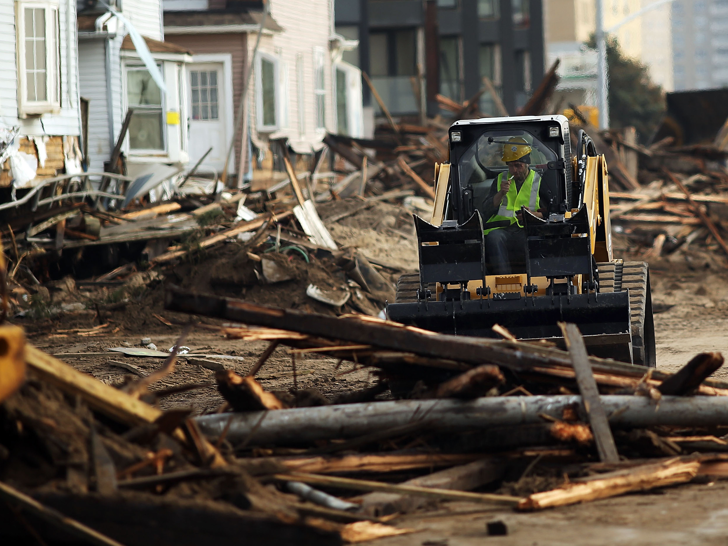 Two weeks after Superstorm Sandy, clean-up continues in the heavily damaged Rockaway neighborhood of the Queens borough of New York City. Two weeks after Superstorm Sandy, clean-up continues in the heavily damaged Rockaway neighborhood of the Queens borough of New York City.