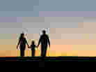 Silhouette of parents and child. Silhouette of parents and child.