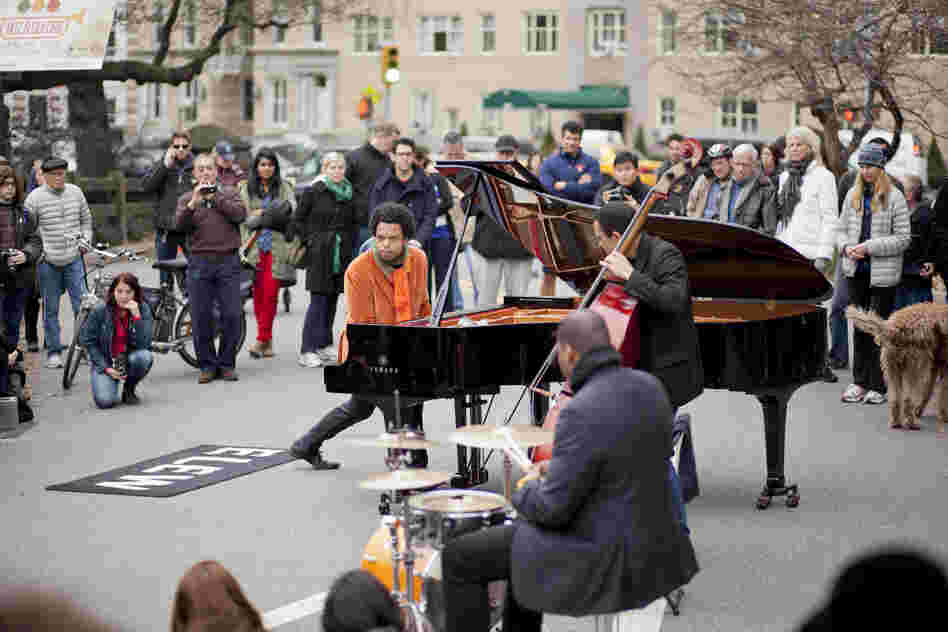 The pianist Eric Lewis, known as ELEW, played unamplified with a trio at the West 90th Street entrance to the park.