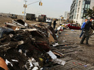 Volunteers help to clean up in the heavily damaged Rockaway neighborhood where a large section of the iconic boardwalk was washed away. Volunteers help to clean up in the heavily damaged Rockaway neighborhood where a large section of the iconic boardwalk was washed away.