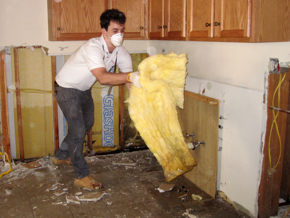 Jonathan Hughes volunteers with the relief organization AmeriCares, which is helping Superstorm Sandy victims gut their saturated houses in the Rockaways.