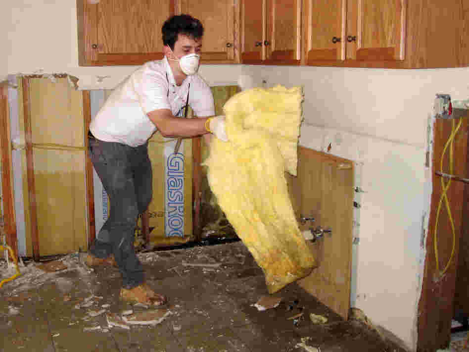 Jonathan Hughes volunteers with the relief organization AmeriCares, which is helping Superstorm Sandy victims gut their saturated houses in the Rockaways.