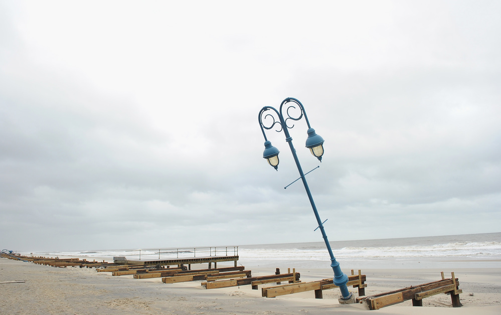 What remains of the 1.2-mile boardwalk sits on the beach on Oct. 30 in Belmar, N.J.