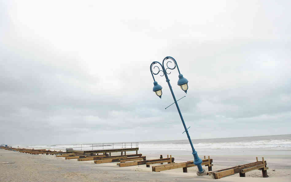 What remains of the 1.2-mile boardwalk sits on the beach on Oct. 30 in Belmar, N.J.