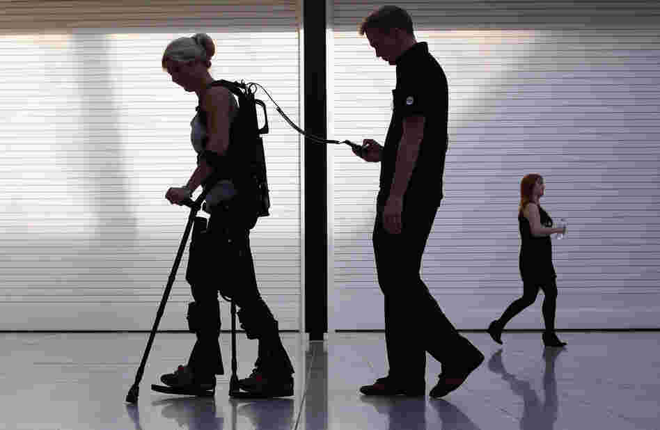 Paralyzed from the waist down, Amanda Boxtel walks with the aid of a bionic exoskeleton in London in 2011. Users learn to walk in the Ekso Bionics device with rehabilitation technicians controlling their steps before walking on their own.