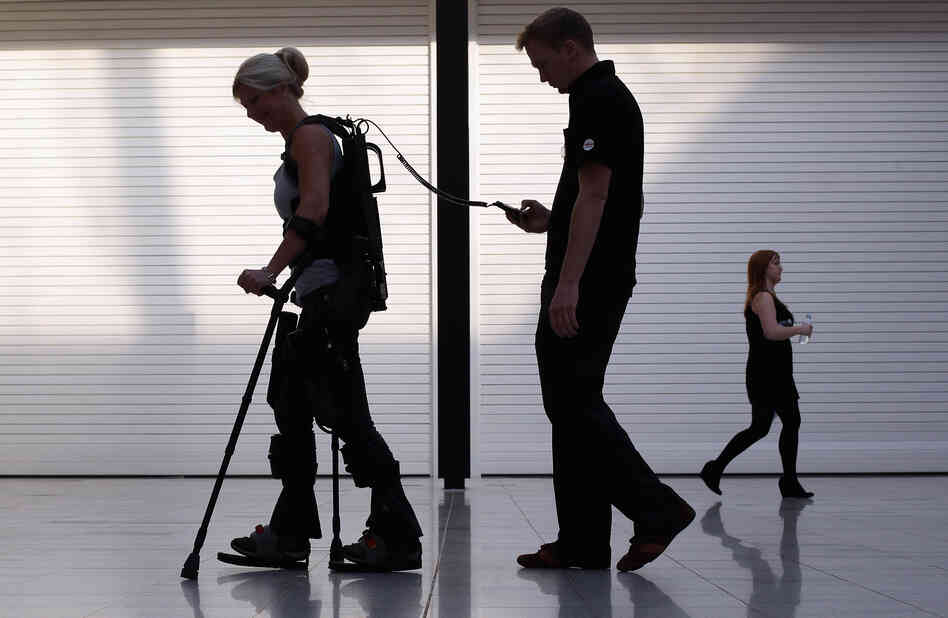 Paralyzed from the waist down, Amanda Boxtel walks with the aid of a bionic exoskeleton in London in 2011. Users learn to walk in the Ekso Bionics device with rehabilitation technicians controlling their steps before walking on their own.