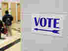 A sign directs voters to the gymnasium at the Martin Luther King elementary school in Milwaukee, Wisconsin, on November 6, 2012. A sign directs voters to the gymnasium at the Martin Luther King elementary school in Milwaukee, Wisconsin, on November 6, 2012.