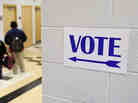 A sign directs voters to the gymnasium at the Martin Luther King elementary school in Milwaukee, Wisconsin, on November 6, 2012. A sign directs voters to the gymnasium at the Martin Luther King elementary school in Milwaukee, Wisconsin, on November 6, 2012.