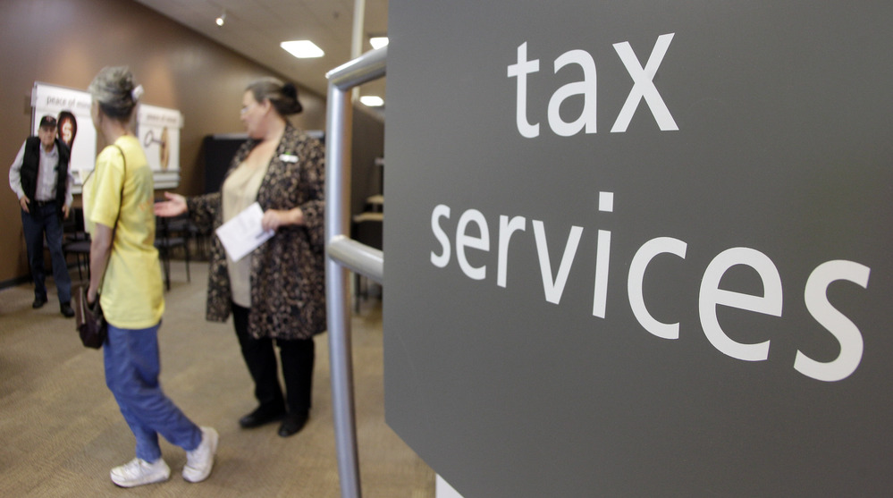 Customers line up at an H&R Block office in Nashville, Tenn., on April 17, the deadline for filing 2011 federal income taxes.
