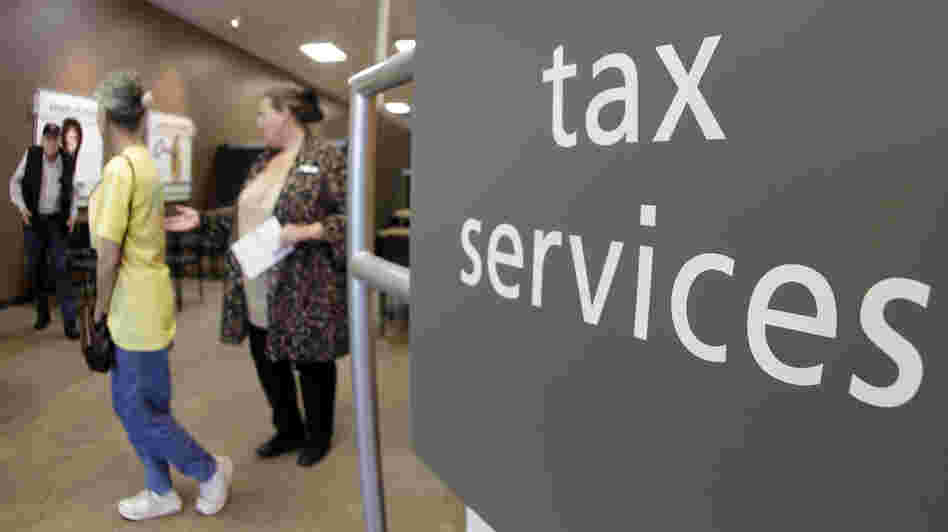 Customers line up at an H&R Block office in Nashville, Tenn., on April 17, the deadline for filing 2011 federal income taxes.