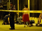 Paramedics treat multiple gunshot victims in Chicago in August. Paramedics treat multiple gunshot victims in Chicago in August.