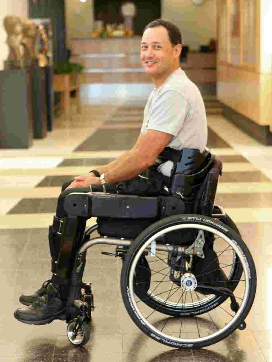 A patient wears the Vanderbilt device in his wheelchair. The Vanderbilt researchers say that it has some advantages over others. It's lighter, breaks into three parts and fits in a small wheelchair.