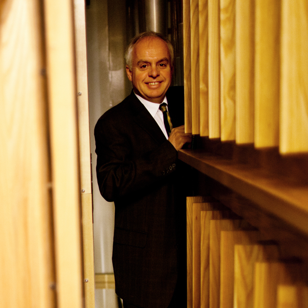 Rochette stands along a narrow passageway deep inside the organ chamber.