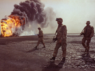 A U.S. Marine patrol walks across the charred oil landscape near a burning well near Kuwait City in March 1991. Concerns about oil supply were at play when the U.S. and its allies intervened during the Iraqi invasion of Kuwait in 1990. But American policy is changing now that Mideast oil imports to the U.S. are declining. A U.S. Marine patrol walks across the charred oil landscape near a burning well near Kuwait City in March 1991. Concerns about oil supply were at play when the U.S. and its allies intervened during the Iraqi invasion of Kuwait in 1990. But American policy is changing now that Mideast oil imports to the U.S. are declining.