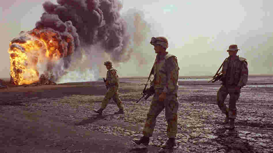 A U.S. Marine patrol walks across the charred oil landscape near a burning well near Kuwait City in March 1991. Concerns about oil supply were at play when the U.S. and its allies intervened during the Iraqi invasion of Kuwait in 1990. But American policy is changing now that Mideast oil imports to the U.S. are declining. A U.S. Marine patrol walks across the charred oil landscape near a burning well near Kuwait City in March 1991. Concerns about oil supply were at play when the U.S. and its allies intervened during the Iraqi invasion of Kuwait in 1990. But American policy is changing now that Mideast oil imports to the U.S. are declining.