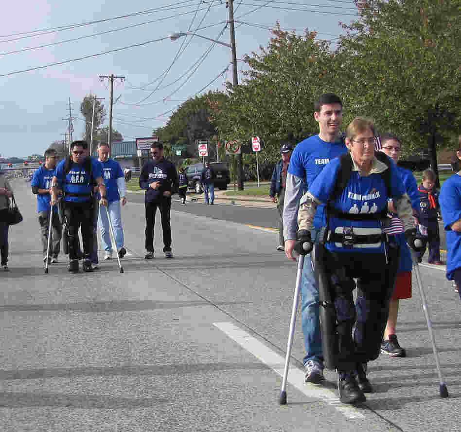 Robert Woo and Theresa Hannigan, both paraplegics, complete a one-mile walk in the ReWalk exoskeleton, developed by an Israeli company called Argo Medical Technologies. Argo's devices have been approved for personal use in Europe, but need FDA approval for sale in the U.S.