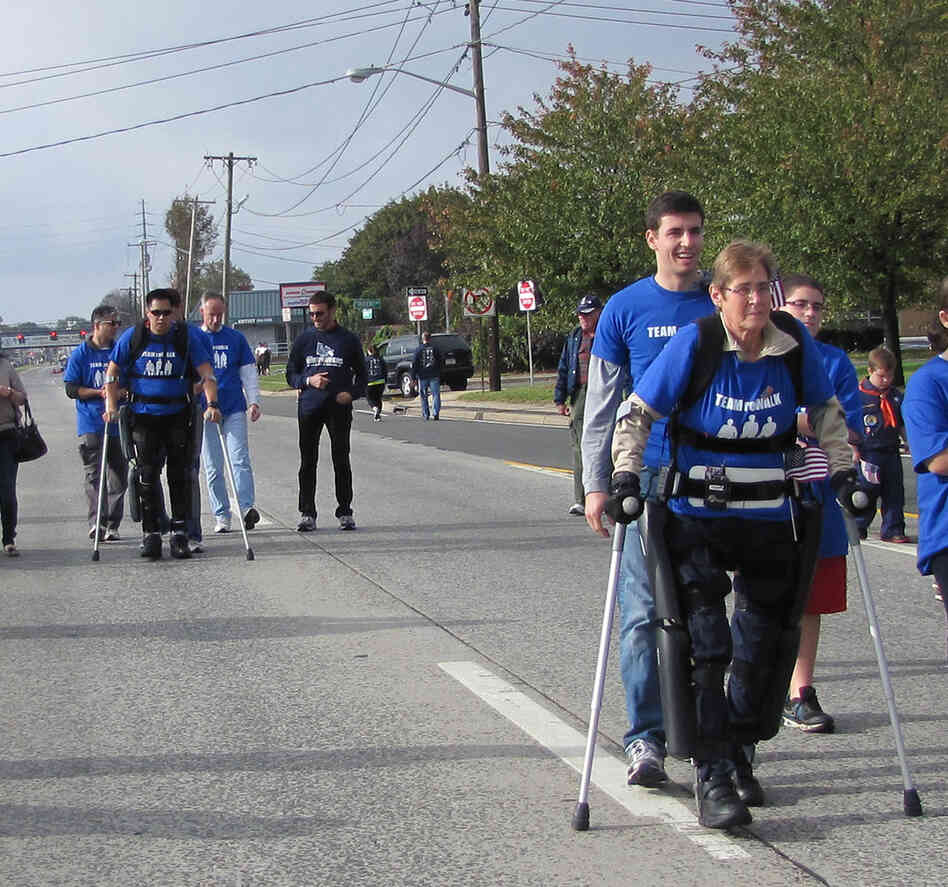 Robert Woo and Theresa Hannigan, both paraplegics, complete a one-mile walk in the ReWalk exoskeleton, developed by an Israeli company called Argo Medical Technologies. Argo's devices have been approved for personal use in Europe, but need FDA approval for sale in the U.S.