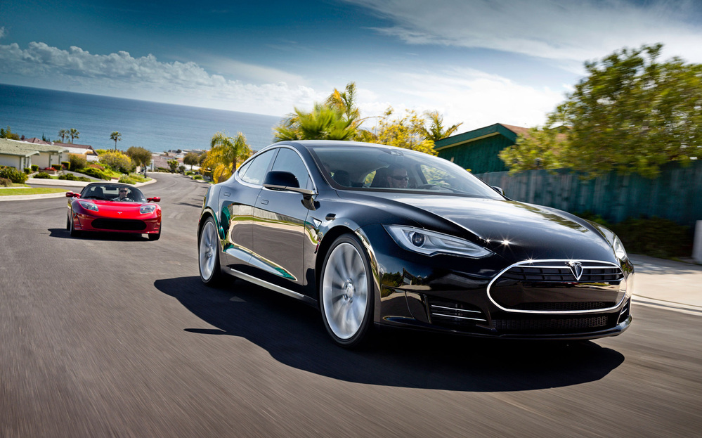 Model S Alpha, in black, and the Telsa Roadster behind it.