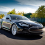 Model S Alpha, in black, and the Telsa Roadster behind it. Model S Alpha, in black, and the Telsa Roadster behind it.