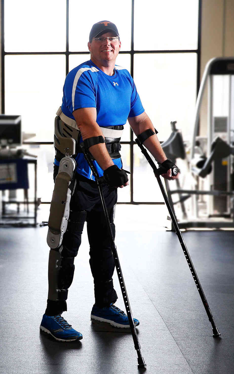Brian Shaffer tests an exoskeleton developed by researchers at Vanderbilt University at a rehabilitation center in Franklin, Tenn. The exoskeleton locks around the legs and feet. To stand up, a paralyzed person simply leans forward.