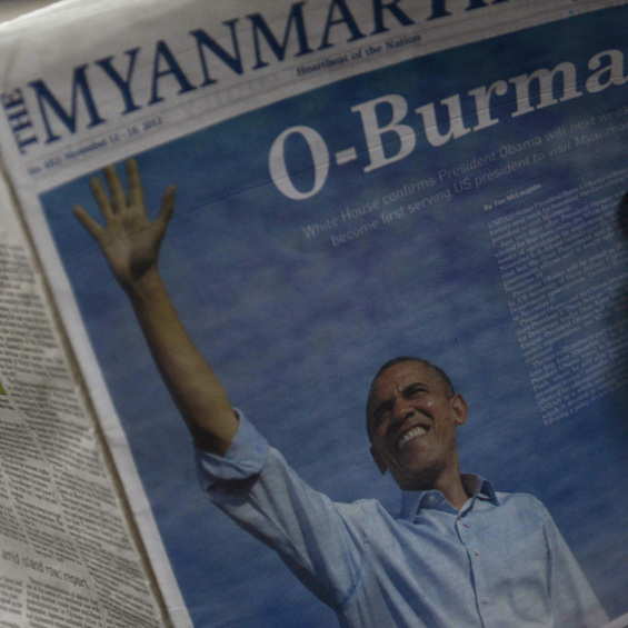 A girl reads a local newspaper with a picture of President Obama at a press house in Yangon, Myanmar, on Thursday, ahead of Obama's visit.