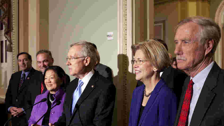 Sen.-elect Angus King of Maine (far right) joins newly elected Democratic senators and Senate Majority Leader Harry Reid on Capitol Hill on Wednesday. From left: Joe Donnelly of Indiana, Tim Kaine of Virginia, Mazie Hirono of Hawaii, Reid, and Elizabeth Warren of Massachusetts.