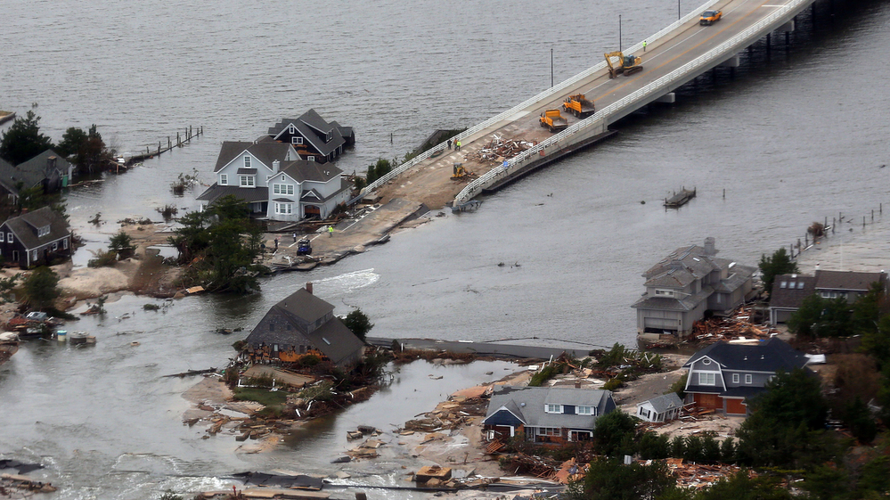 Sandy punched a hole in the barrier island that holds the affluent borough of Mantoloking, N.J., temporarily splitting the community in two. The storm also destroyed several multimillion-dollar homes and erased the island's protective system of dunes.