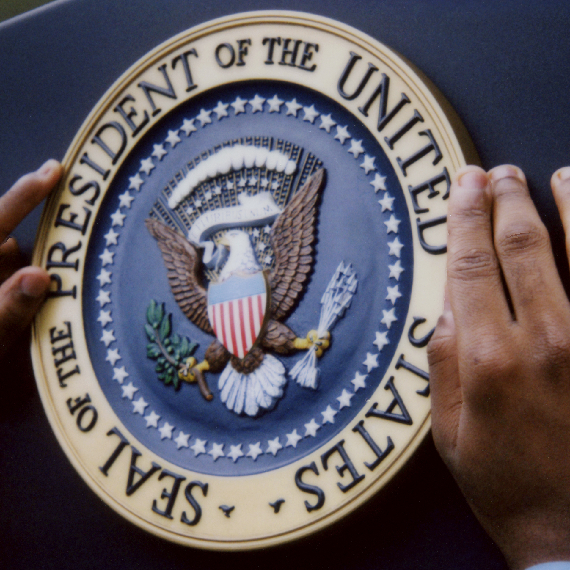 When a president stands at a podium, the presidential seal is right there.