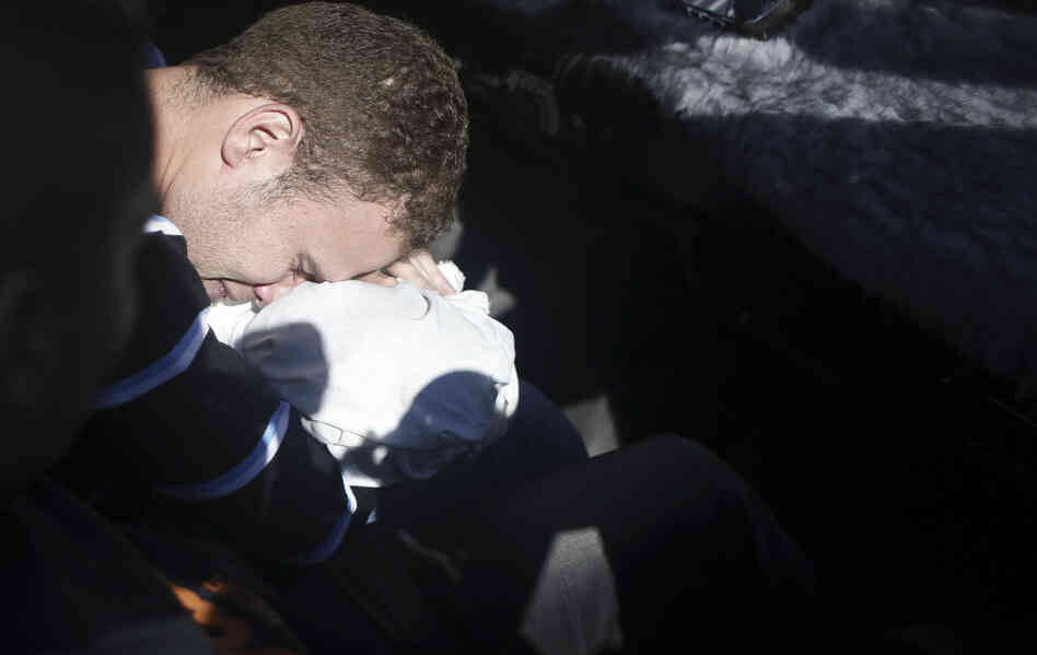 Jihad Masharawi, a Palestinian employee of BBC Arabic in Gaza, mourns over the body of his 11-month-old son. Jihad Masharawi, a Palestinian employee of BBC Arabic in Gaza, mourns over the body of his 11-month-old son.