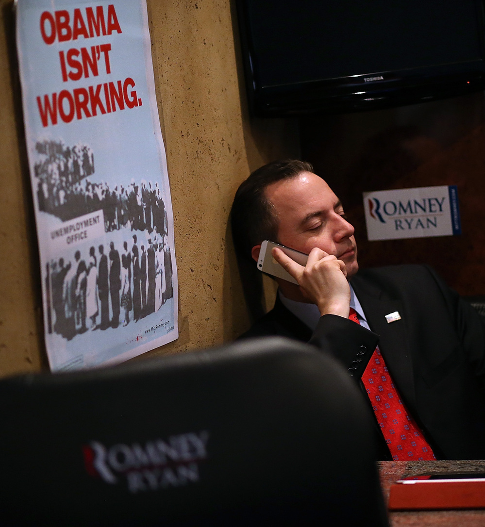 Republican National Committee Chairman Reince Priebus rides the Mitt Romney campaign bus days before the presidential election. Despite Romney's loss and other GOP failures, Priebus, who helped the party raise huge sums of money in 2012, may seek a second term.
