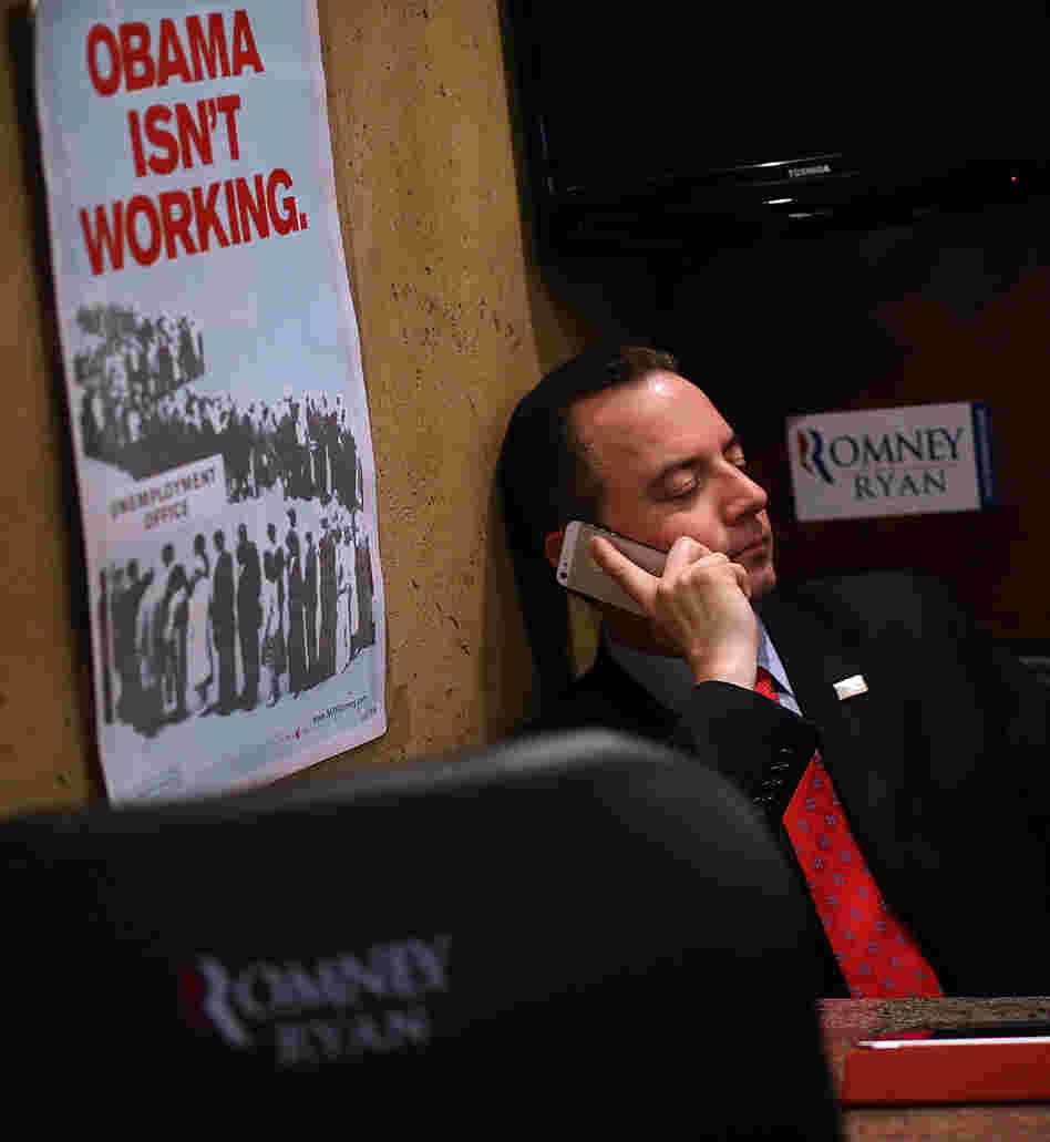 Republican National Committee Chairman Reince Priebus rides the Mitt Romney campaign bus days before the presidential election. Despite Romney's loss and other GOP failures, Priebus, who helped the party raise huge sums of money in 2012, may seek a second term.