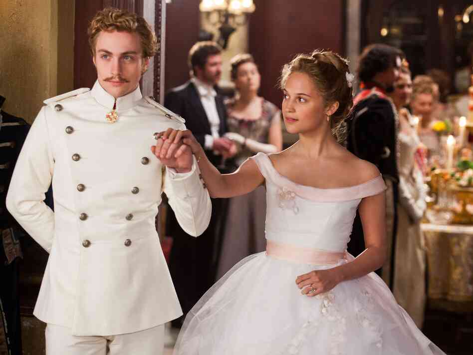 The as-yet-unmarried Kitty (Alicia Vikander) harbors a naive passion for Vronsky (Aaron Taylor-Johnson), who has his eyes on a less suitable prize.