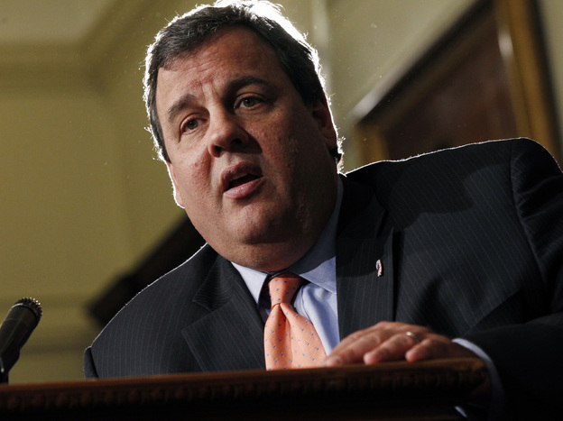 New Jersey Gov. Chris Christie listens to a question in Trenton, N.J., Tuesday. He has refused to tip his hand on whether New Jersey will set up a federally mandated health insurance exchange or let the federal government handle the chores.