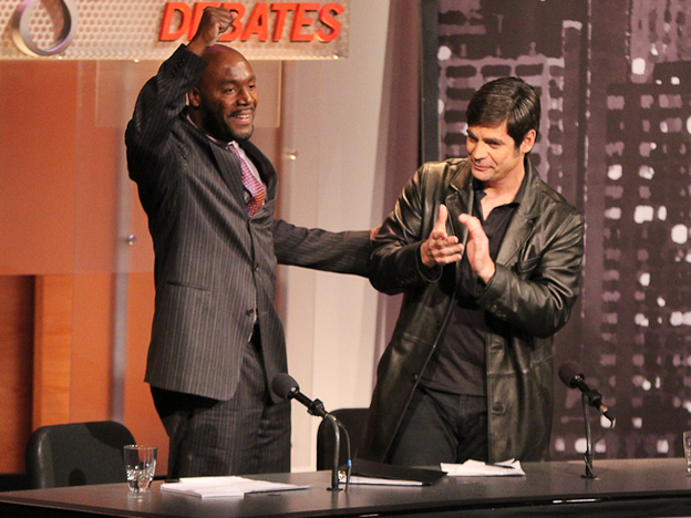 Paul Butler (left) and Nick Gillespie celebrate their victory in an Intelligence Squared U.S. debate. They argued in favor of legalizing drugs.