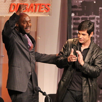 Paul Butler (left) and Nick Gillespie celebrate their victory in an Intelligence Squared U.S. debate. They argued in favor of legalizing drugs.
