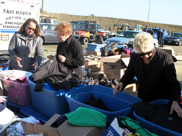 Volunteers sort through donated clothes in Sea Bright, N.J.