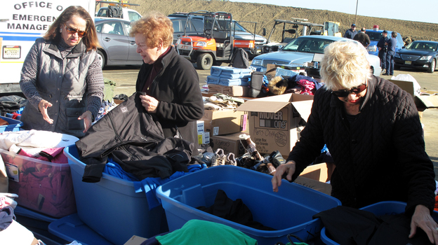 Volunteers sort through donated clothes in Sea Bright, N.J. (NPR)